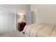 Bright bedroom featuring a double bed and a wooden dresser at 1918 Yankee Clipper Run, The Villages, FL 32162