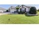 One-story house with a two-car garage and manicured lawn at 1918 Yankee Clipper Run, The Villages, FL 32162