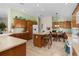 Bright kitchen with light wood cabinets and an island at 1918 Yankee Clipper Run, The Villages, FL 32162