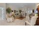 Open living room with a view into the entryway and kitchen at 1918 Yankee Clipper Run, The Villages, FL 32162