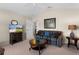 Relaxing sitting area featuring a sofa, coffee table, and TV at 1918 Yankee Clipper Run, The Villages, FL 32162