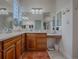 Elegant bathroom with dual sinks and a walk-in shower at 2010 Allure Loop, The Villages, FL 32162