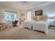 Spacious bedroom with twin beds and a home office at 2010 Allure Loop, The Villages, FL 32162