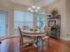 Charming dining room featuring a round table and hardwood floors at 2010 Allure Loop, The Villages, FL 32162