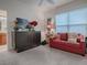 Comfortable guest room with a sleeper sofa and built-in cabinet at 2010 Allure Loop, The Villages, FL 32162