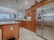 Modern kitchen with stainless steel appliances and an island at 2010 Allure Loop, The Villages, FL 32162