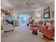 Spacious living room with access to an outdoor patio and dining area at 2010 Allure Loop, The Villages, FL 32162