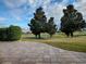 Spacious paved patio overlooking a golf course at 2010 Allure Loop, The Villages, FL 32162