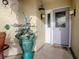 Front entry with decorative potted plants and a welcoming mat at 2057 Countrywind Ct, The Villages, FL 32162