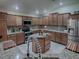 Large kitchen with an island, granite countertops, and stainless steel appliances at 2057 Countrywind Ct, The Villages, FL 32162