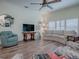 Relaxing living room featuring hardwood floors and comfy furniture at 2057 Countrywind Ct, The Villages, FL 32162