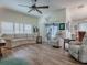 Bright living room with hardwood floors and large windows at 2057 Countrywind Ct, The Villages, FL 32162