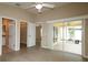 Main bedroom with access to screened porch and walk-in closet at 2078 Pink Blossom Ct, The Villages, FL 32162