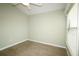 Simple bedroom featuring a ceiling fan and large window at 2078 Pink Blossom Ct, The Villages, FL 32162