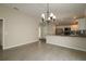 Dining room with hardwood floors and a chandelier at 2078 Pink Blossom Ct, The Villages, FL 32162