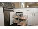 Stainless steel appliances and granite countertops in this kitchen at 2078 Pink Blossom Ct, The Villages, FL 32162