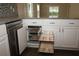 Modern kitchen with pull-out drawers and sleek design at 2078 Pink Blossom Ct, The Villages, FL 32162