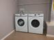 Bright laundry room features a washer and dryer at 2078 Pink Blossom Ct, The Villages, FL 32162