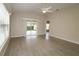 Living room with hardwood floors and access to backyard patio at 2078 Pink Blossom Ct, The Villages, FL 32162