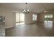 Spacious living room with hardwood floors and sliding glass doors at 2078 Pink Blossom Ct, The Villages, FL 32162