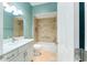 Bathroom with white vanity, bathtub and teal walls at 2096 Odessa Cir, The Villages, FL 32162