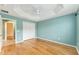 Bedroom with hardwood floors, ceiling fan, and double closet at 2096 Odessa Cir, The Villages, FL 32162