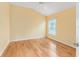 Bedroom with light yellow walls and hardwood floors at 2096 Odessa Cir, The Villages, FL 32162