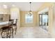 Casual dining area with view to backyard and kitchen at 2096 Odessa Cir, The Villages, FL 32162