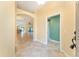 Bright and airy entryway with tile flooring and views into the living area at 2096 Odessa Cir, The Villages, FL 32162