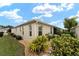 Side view of house with well-manicured landscaping at 2096 Odessa Cir, The Villages, FL 32162