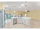 Kitchen island with seating and stainless steel dishwasher at 2096 Odessa Cir, The Villages, FL 32162