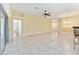 Bright and airy living room with tile floors, and adjacent kitchen at 2096 Odessa Cir, The Villages, FL 32162