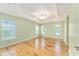 Bright main bedroom with wood floors and neutral walls at 2096 Odessa Cir, The Villages, FL 32162