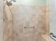 Walk-in shower with tiled walls and built-in seat at 2096 Odessa Cir, The Villages, FL 32162