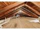 Unfinished attic space with wood flooring and exposed beams at 211 Cassady St, Umatilla, FL 32784