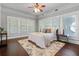 Spacious bedroom with hardwood floors and ceiling fan at 211 Cassady St, Umatilla, FL 32784