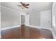 Bright bedroom featuring hardwood floors and ceiling fan at 211 Cassady St, Umatilla, FL 32784