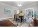 Elegant dining room with hardwood floors and a large dining table at 211 Cassady St, Umatilla, FL 32784