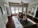 Sunlit dining room with hardwood floors and a large table at 211 Cassady St, Umatilla, FL 32784