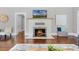 White brick fireplace with ornate screen in the living room at 211 Cassady St, Umatilla, FL 32784