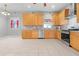 Modern kitchen with light wood cabinets and stainless steel appliances at 211 Cassady St, Umatilla, FL 32784