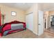 Bedroom with daybed, closet, and access to another room at 2187 County Road 243C, Wildwood, FL 34785