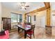 Dining area with hardwood floors and a view into the adjacent living room at 2187 County Road 243C, Wildwood, FL 34785