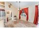 Light-filled dining room with wood floors and chandelier at 2187 County Road 243C, Wildwood, FL 34785