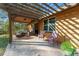 Outdoor patio furniture under a pergola at 2187 County Road 243C, Wildwood, FL 34785