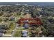 Aerial view highlighting home, pool, and surrounding neighborhood at 23720 Sundance Dr, Sorrento, FL 32776