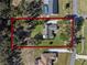 Aerial view of a house and large property at 23720 Sundance Dr, Sorrento, FL 32776