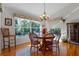 Charming dining area with hardwood floors and large windows at 23720 Sundance Dr, Sorrento, FL 32776