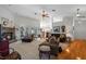 Living room features hardwood floors, fireplace, and natural light at 23720 Sundance Dr, Sorrento, FL 32776