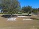 Community playground with swings, climbing bars, and slide at 23720 Sundance Dr, Sorrento, FL 32776